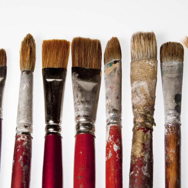 Six small used paint brushes